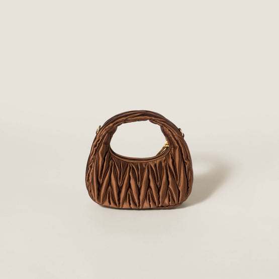 Wander matelassé satin mini-bag