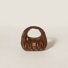 Wander matelassé satin mini-bag