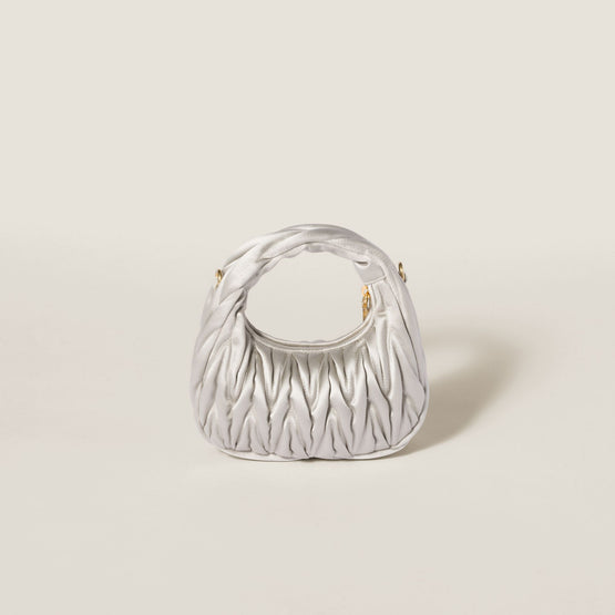 Wander matelassé satin mini-bag
