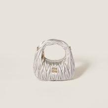 Wander matelassé satin mini-bag
