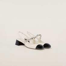 Leather and patent leather slingback pumps