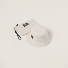 Reversible hat with pouch